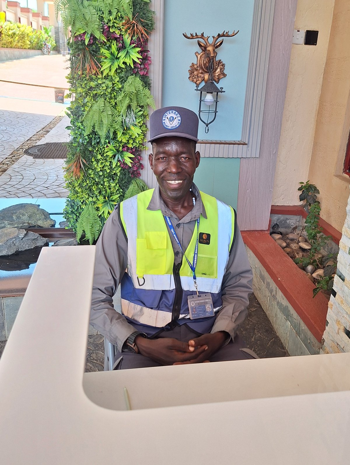 Smiling Intersec Security Group officer on duty at a client site